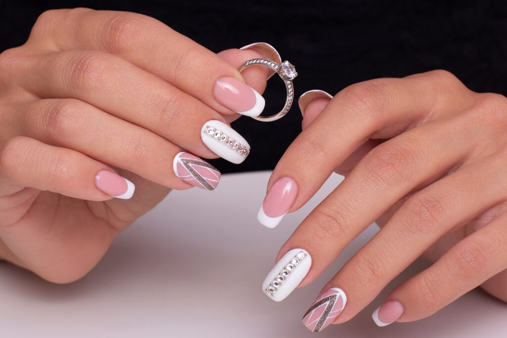 Manicure iwth metallic accents on soft colored nails