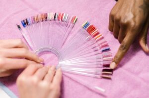 which manicure style do you love? Salon patron chooses from color sample...